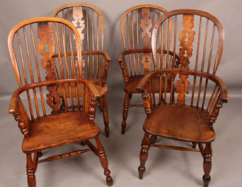 A Harlequin Set of Four Windsor Chairs