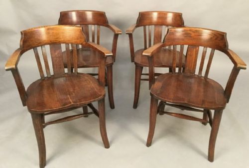 A Set of Six Captains Chairs