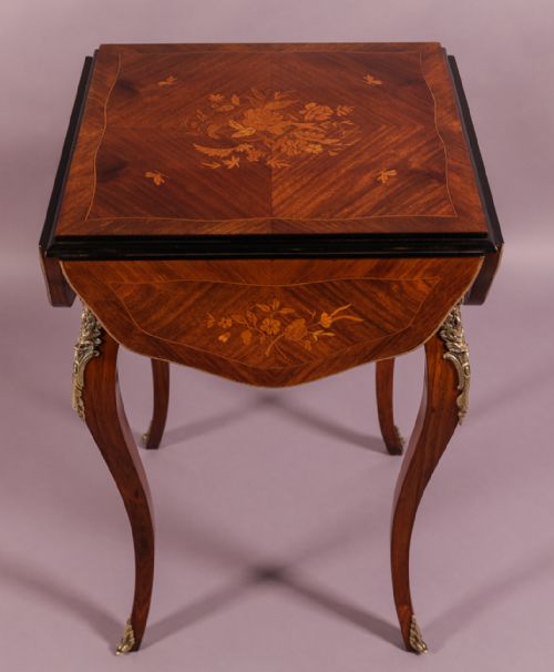 A French Kingwood Table with Marquerty Inlay