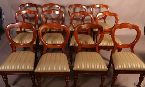 A Good Set of 12 Victorian Mahogany Balloon Back Dining Chairs