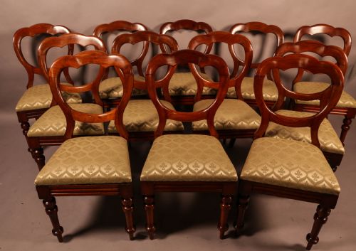A Good Set of 12 Victorian Mahogany Balloon Back Dining Chairs