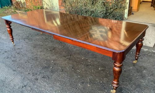 A Victorian Mahogany Extending Dining Table with 3 Leaves Seats 12