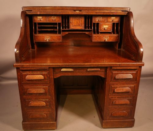 A Good Oak Roll Top Desk by Maples London