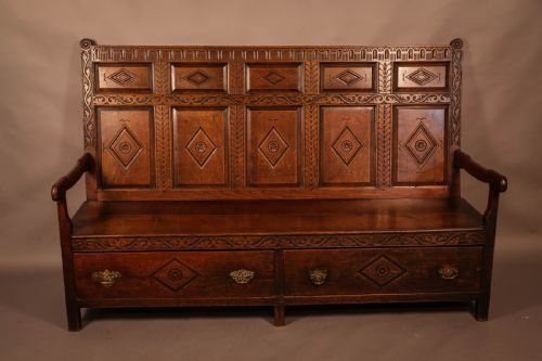 A Georgian Oak Settle with Storage Drawers