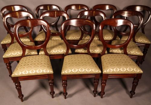 A Set of 12 Victorian Mahogany Balloon Back Dining Chairs