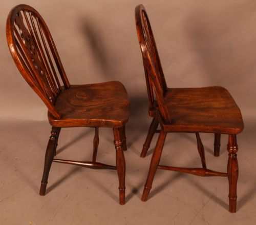A NEAR PAIR OF YEW WOOD KITCHEN WINDSOR CHAIRS - ADDITIONAL PHOTO 4