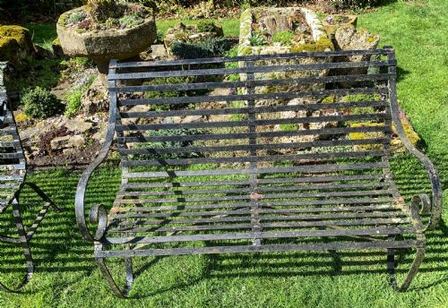 A RARE MATCHING PAIR OF WROUGHT IRON GARDEN BENCHES - ADDITIONAL PHOTO 1