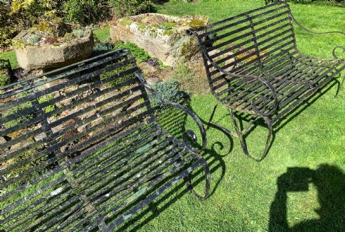 A RARE MATCHING PAIR OF WROUGHT IRON GARDEN BENCHES - ADDITIONAL PHOTO 4
