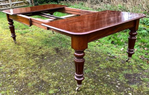A GOOD VICTORIAN 2 LEAF EXTENING DINING TABLE IN MAHOGANY - ADDITIONAL PHOTO 7