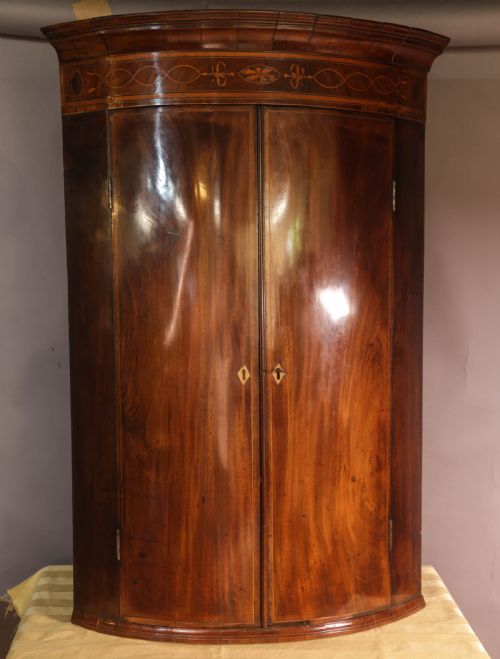 a georgian bow front corner cupboard mahogany inlaid - CATEGORY: ANTIQUE CUPBOARDS - DATED 18TH CENTURY