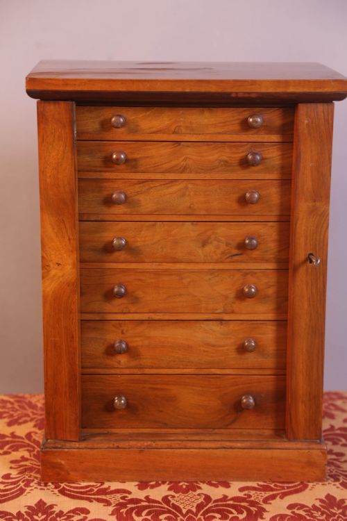 a miniature wellington chest in walnut - CATEGORY: ANTIQUE CHEST OF DRAWERS - DATED VICTORIAN
