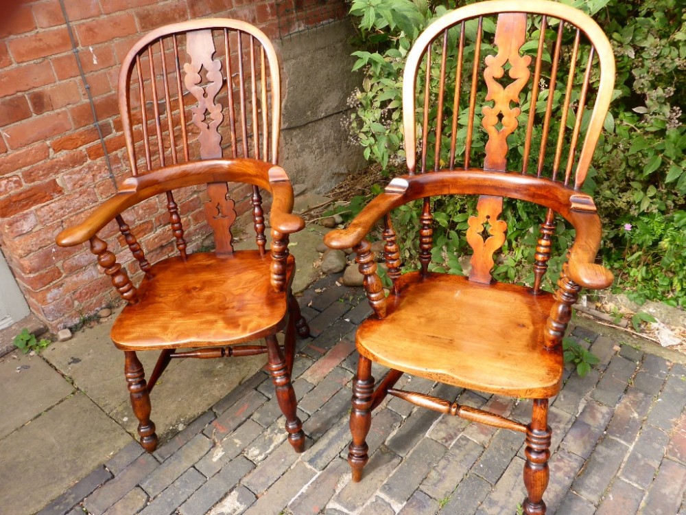 A Near Pair of Victorian Broad Arm Windsor Armchairs