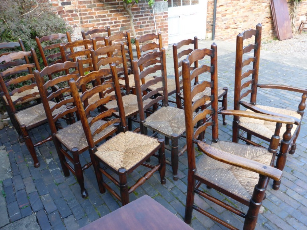 Harlequin Set of 14 Antique Ladder Back Dining Chairs