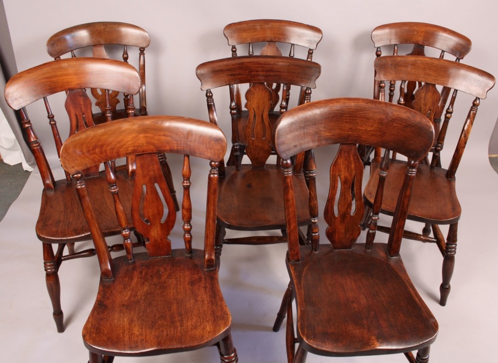 A Harlequin Set of 8 Victorian Kitchen Chairs