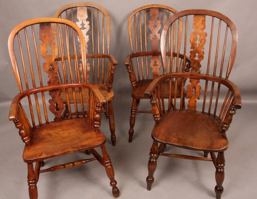 A Harlequin Set of Four Windsor Chairs