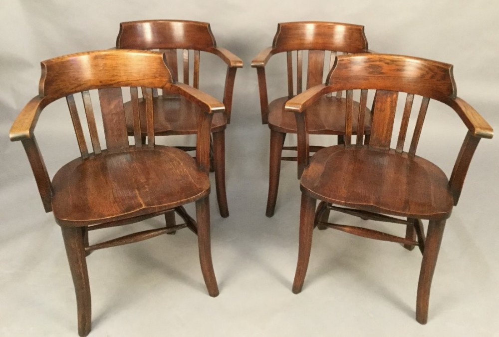 A Set of Six Captains Chairs