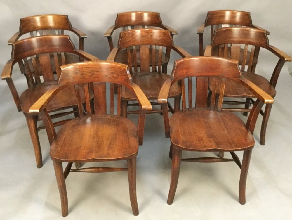 A Set of 8 Captains Chairs in Oak
