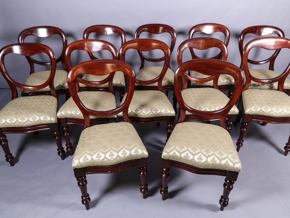 A set of 12 Victorian Mahogany Balloon Back Dining Chairs