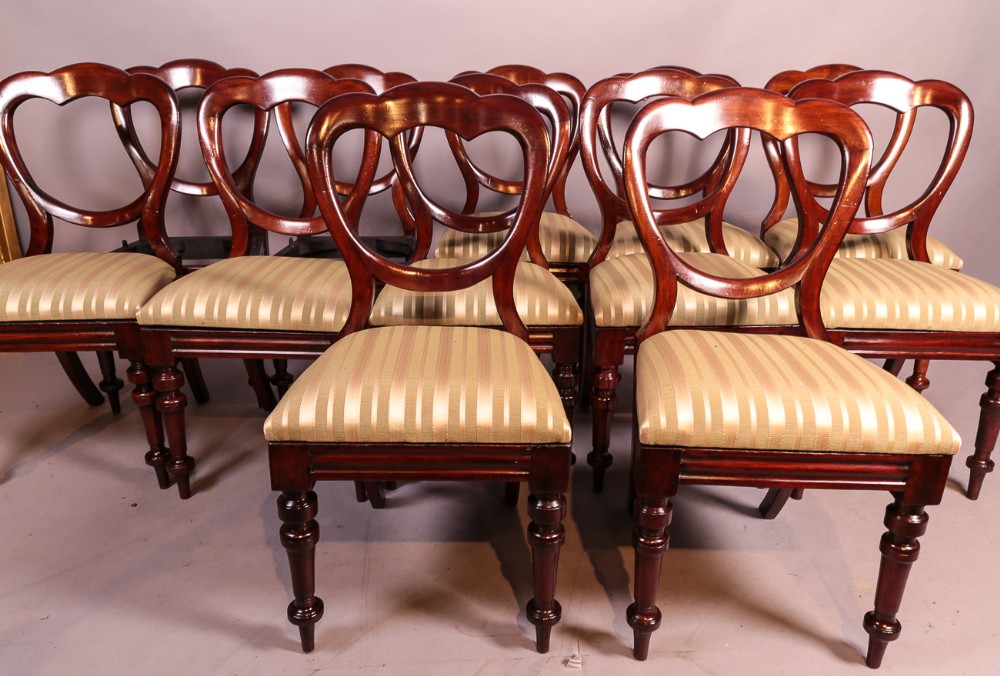 A Set of 12 Victorian Mahogany Balloon Back Dining Chairs