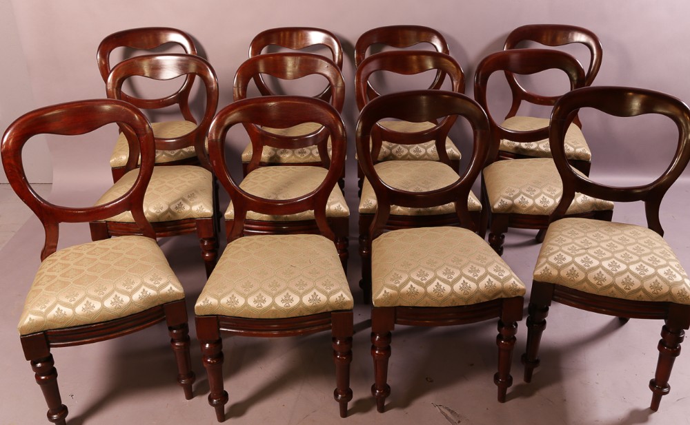 A Set of 12 Victorian Mahogany Balloon Back Dining Chairs
