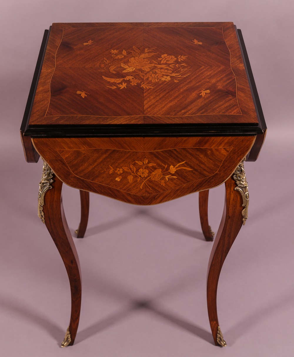 A French Kingwood Table with Marquerty inlay