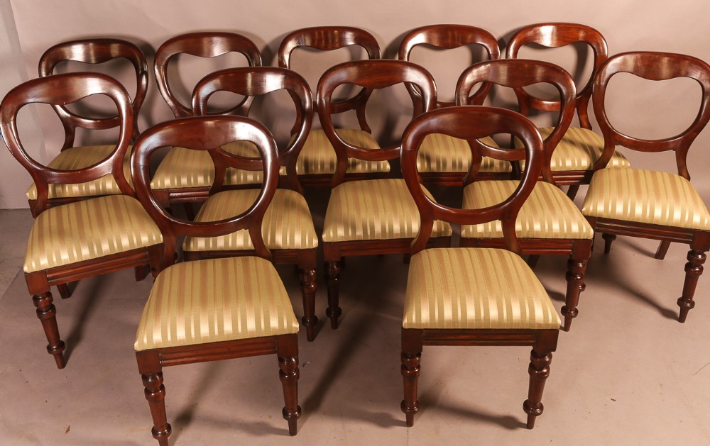 A Set of 12 Victorian Mahogany Balloon Back Dining Chairs