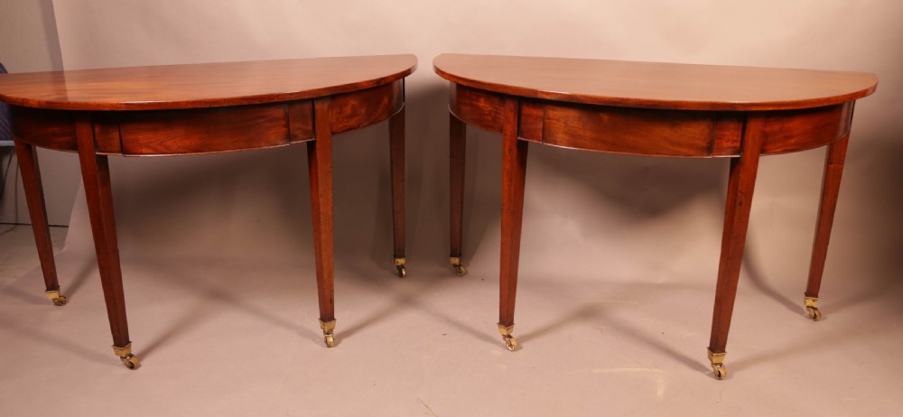 A pair of 18th century Demi Lune hall tables