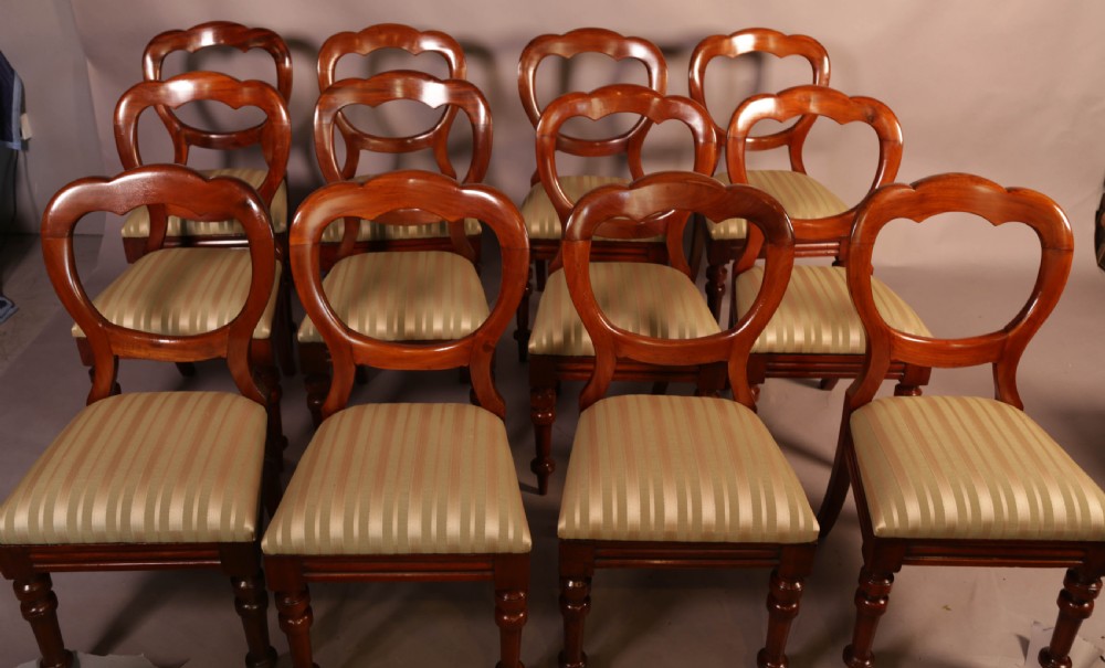 A Good Set of 12 Victorian Mahogany Balloon Back dining Chairs