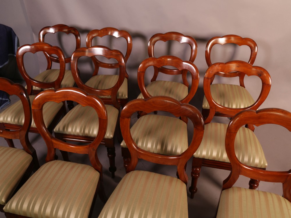 A Good Set of 12 Victorian Mahogany Balloon Back dining Chairs View II