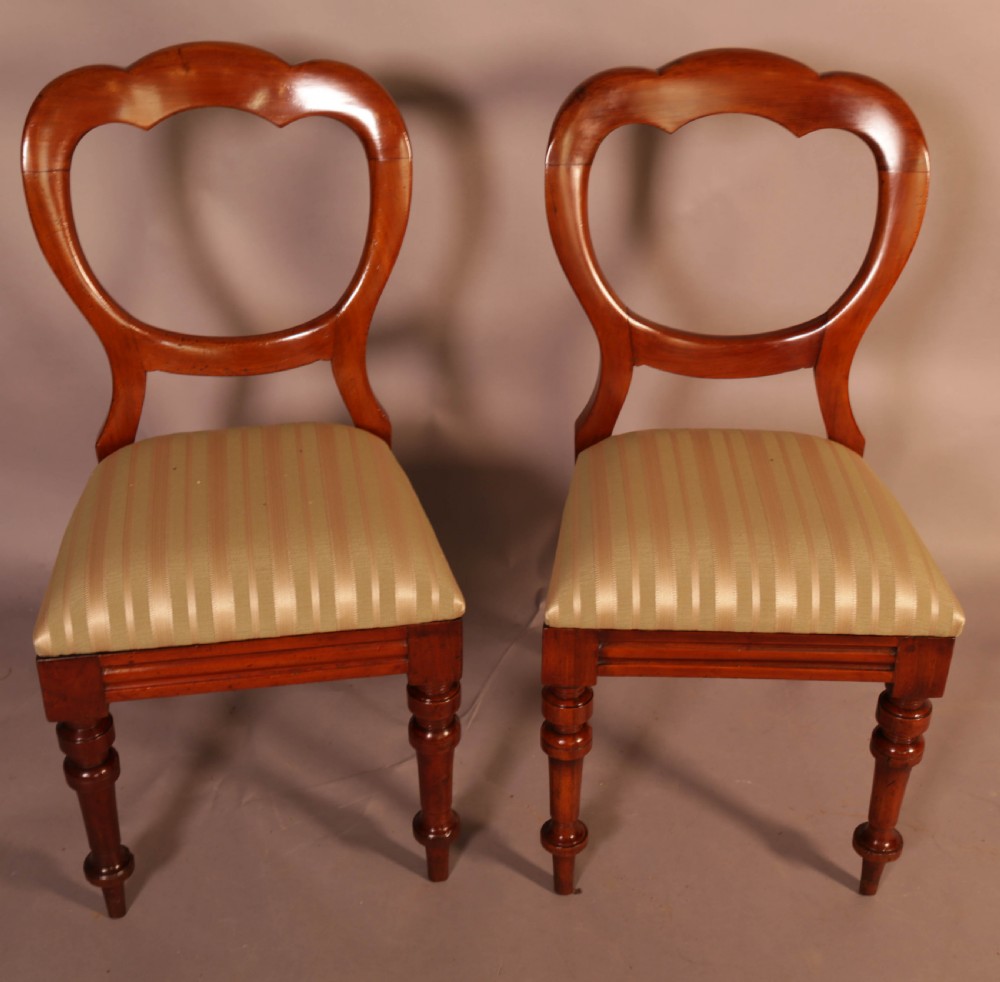 A Good Set of 12 Victorian Mahogany Balloon Back dining Chairs View V