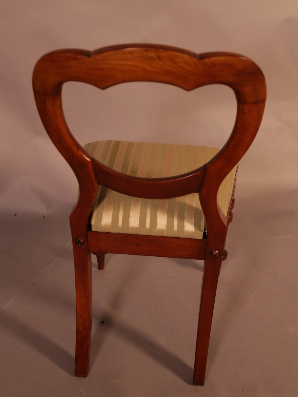 A Good Set of 12 Victorian Mahogany Balloon Back dining Chairs View VIII