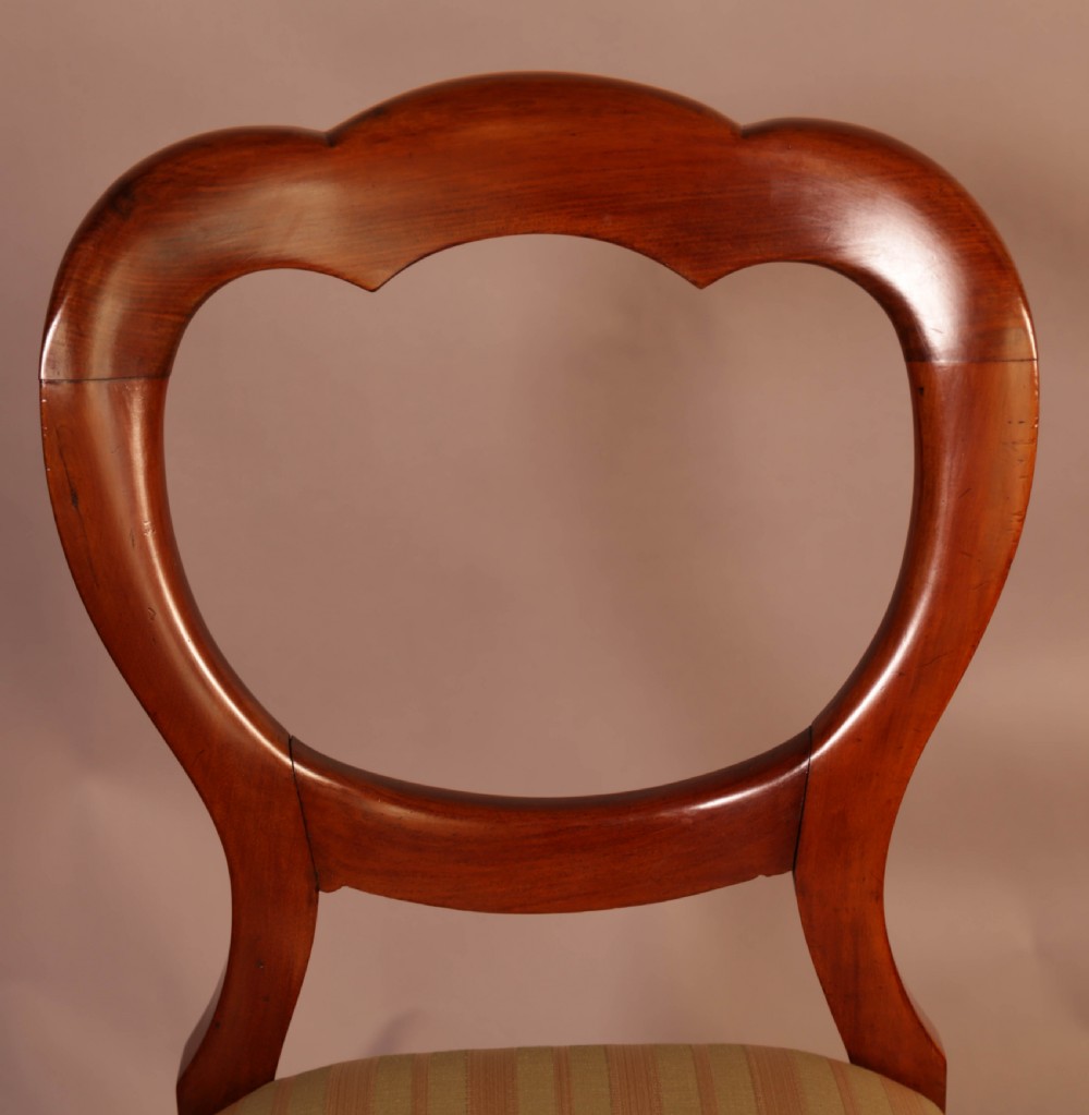 A Good Set of 12 Victorian Mahogany Balloon Back dining Chairs View IX