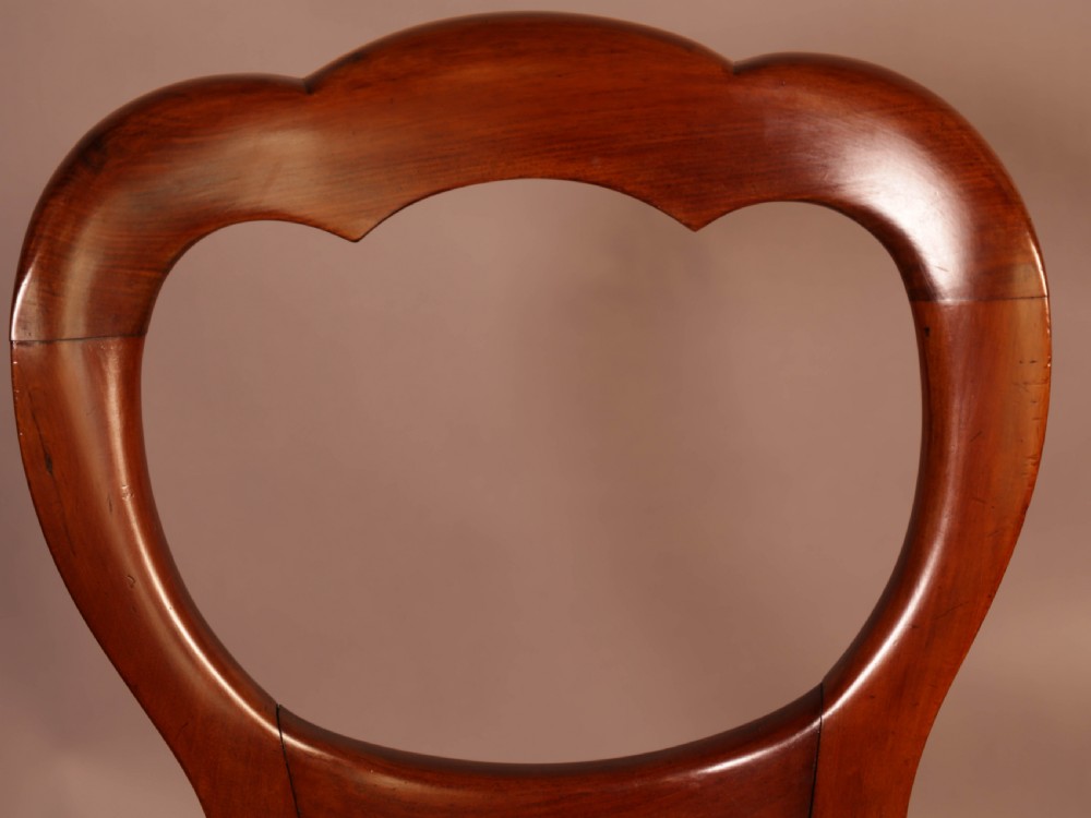 A Good Set of 12 Victorian Mahogany Balloon Back dining Chairs View X