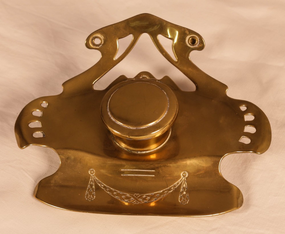 An Art Neuvaux Inkwell in Brass