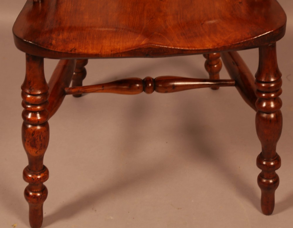 A Yew Wood Broad Arm Windsor chair Allsop Worksop View X