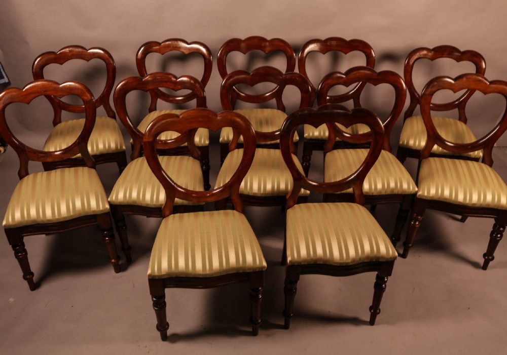 A Good Set of 12 Victorian Mahogany Balloon Back Dining Chairs