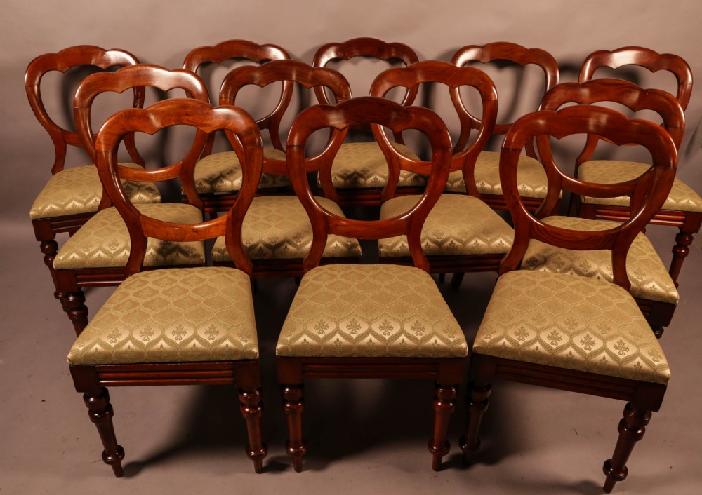 A Good set of 12 Victorian Mahogany Balloon Back dining chairs