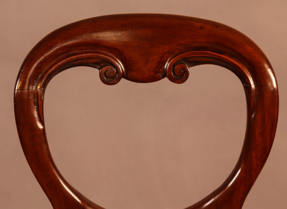 A Set of 12 Victorian Mahogany Balloon Back Dining Chairs View X