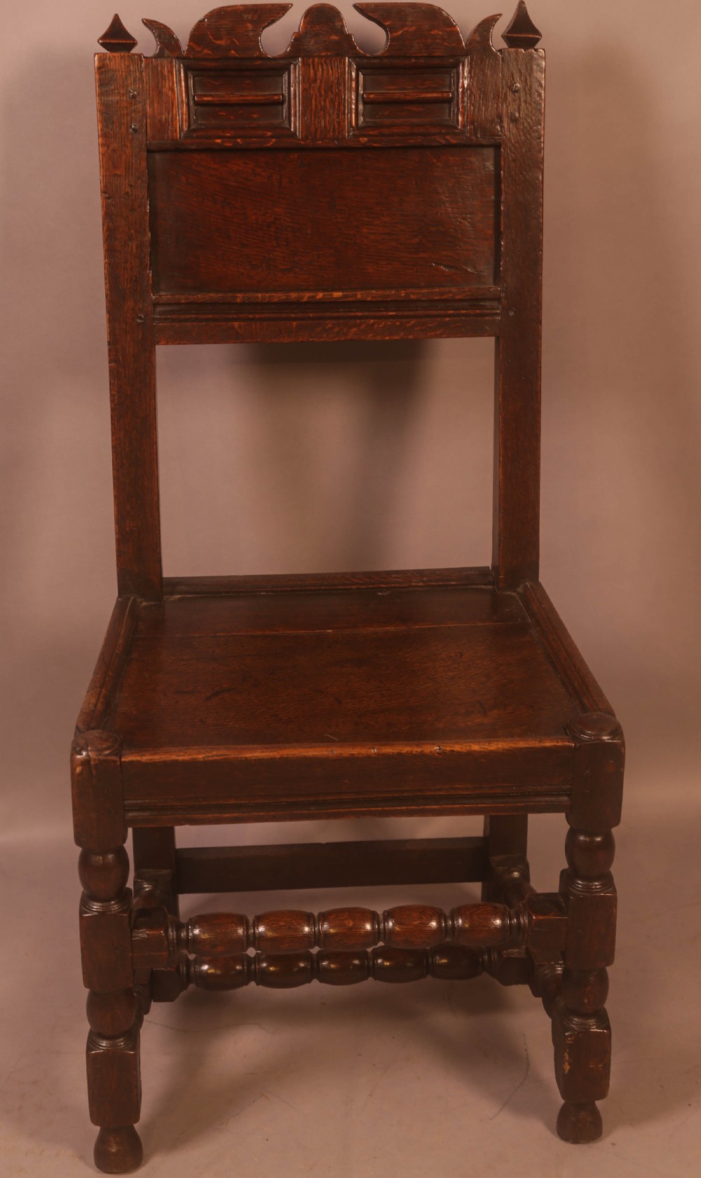 A 17th century Oak Back Stool