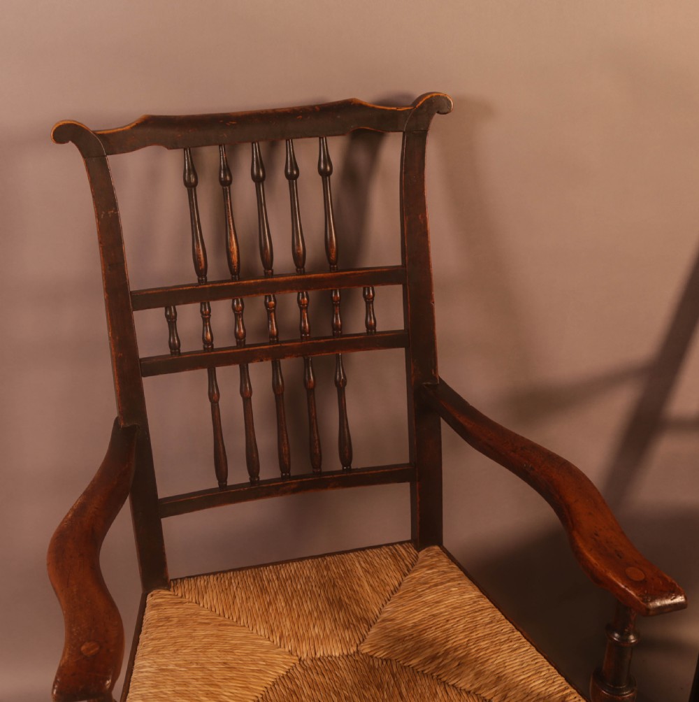 A Pair of 19th century Spindle Back Armchairs with rush seats View II