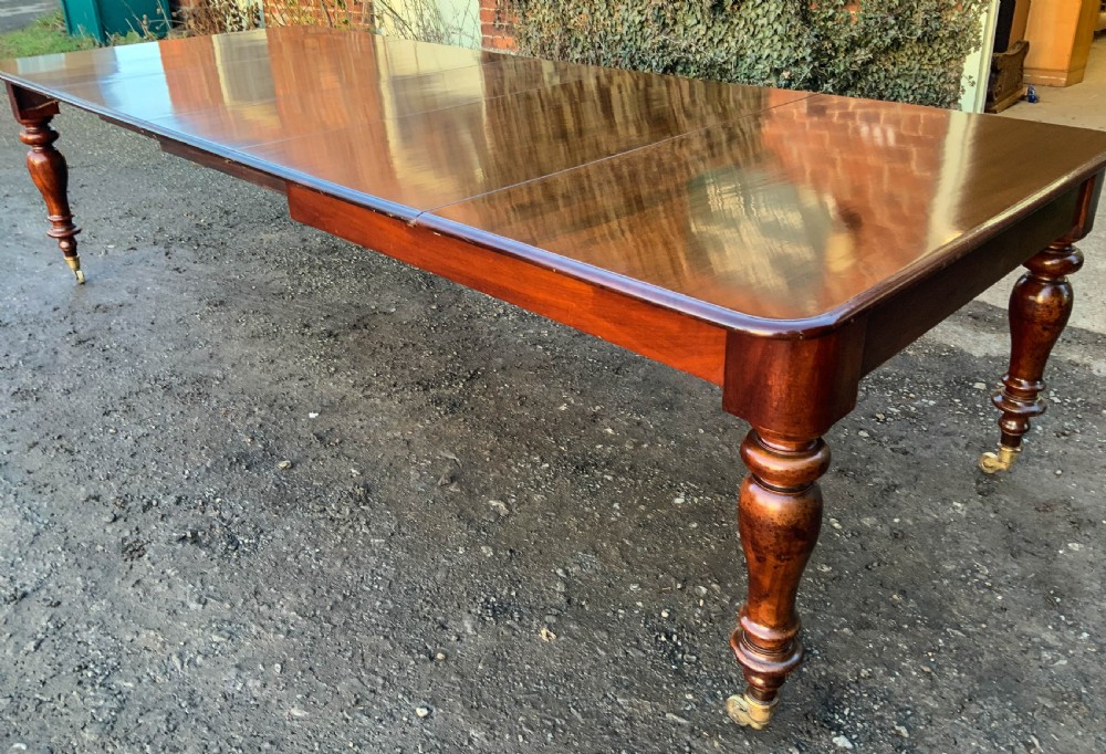 A Victorian Mahogany Extending Dining Table with 3 Leaves seats 12 View II