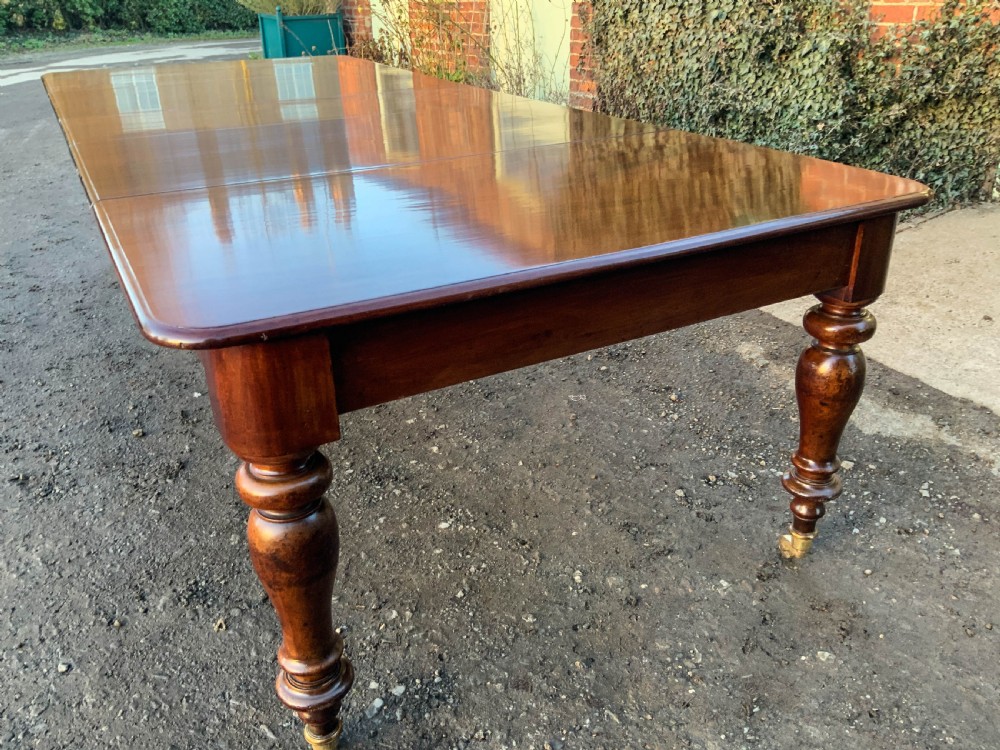 A Victorian Mahogany Extending Dining Table with 3 Leaves seats 12 View IV