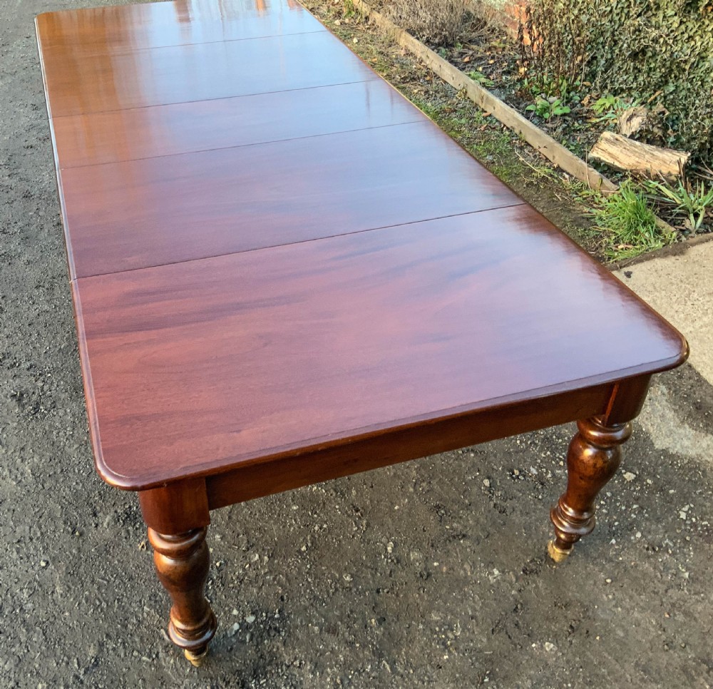 A Victorian Mahogany Extending Dining Table with 3 Leaves seats 12 View V