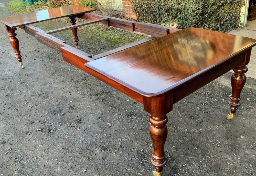 A Victorian Mahogany Extending Dining Table with 3 Leaves seats 12 View VI