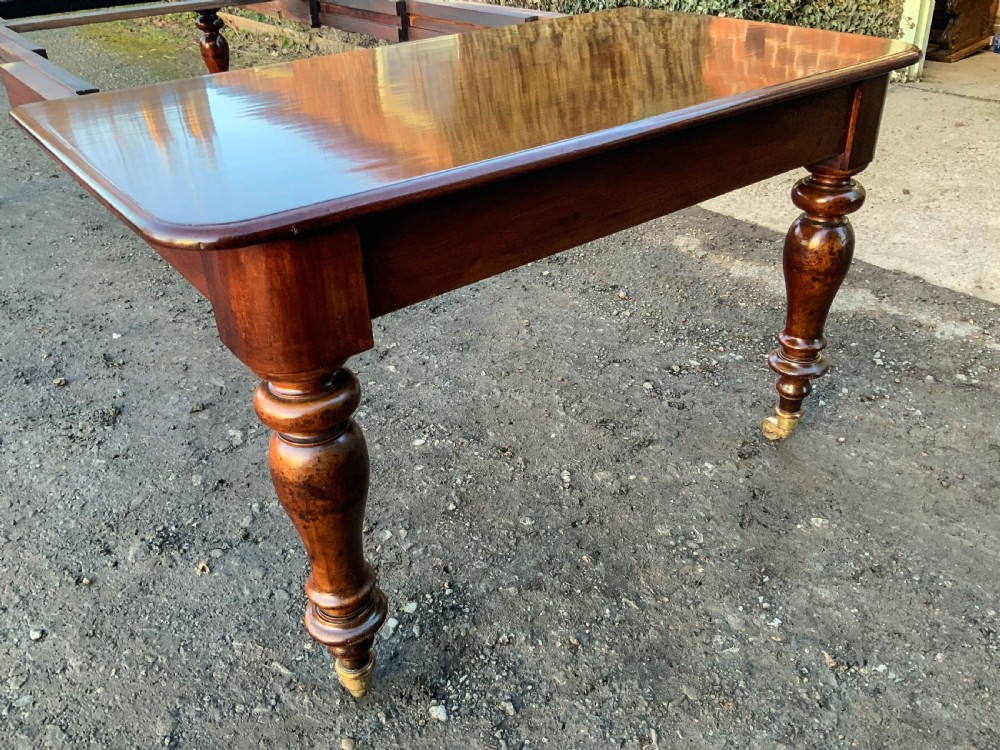 A Victorian Mahogany Extending Dining Table with 3 Leaves seats 12 View VII
