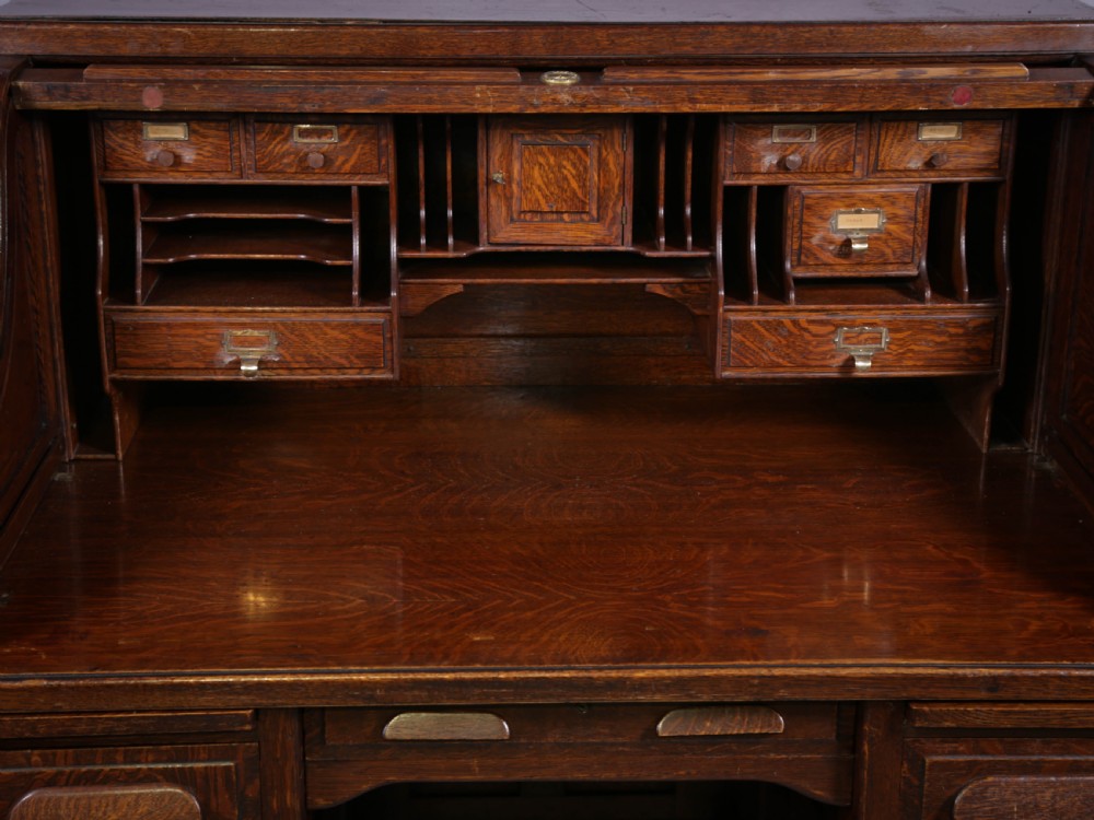 A good Oak Roll Top Desk by Maples London View V