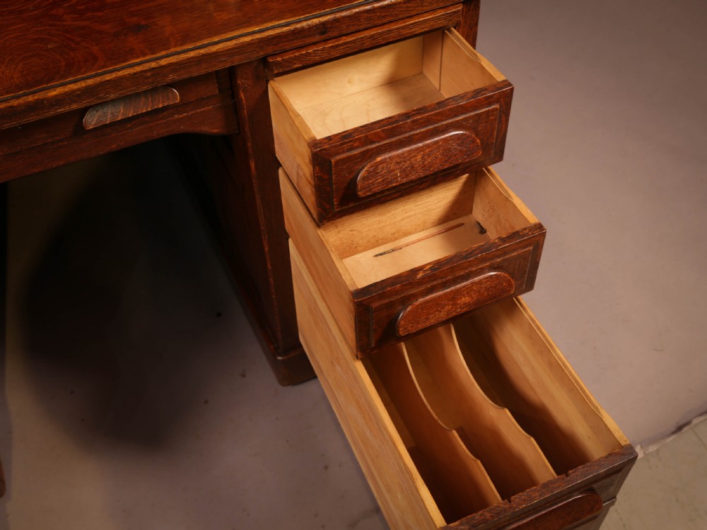 A good Oak Roll Top Desk by Maples London View X