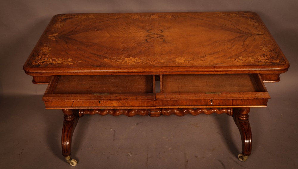 A Victorian Burr Walnut Library Table Inlaid View III
