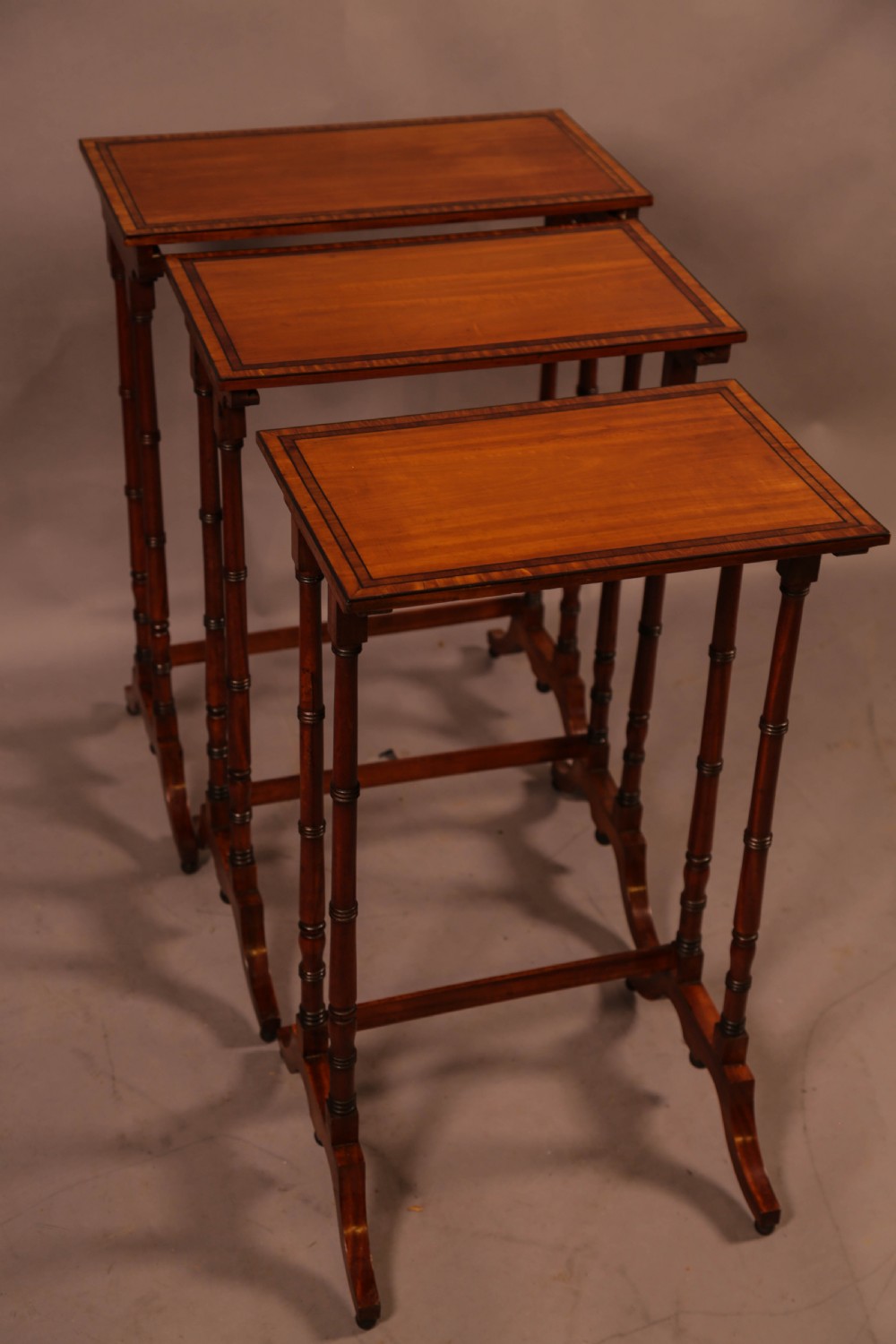 A Regency Nest of Three Tables in Satinwood