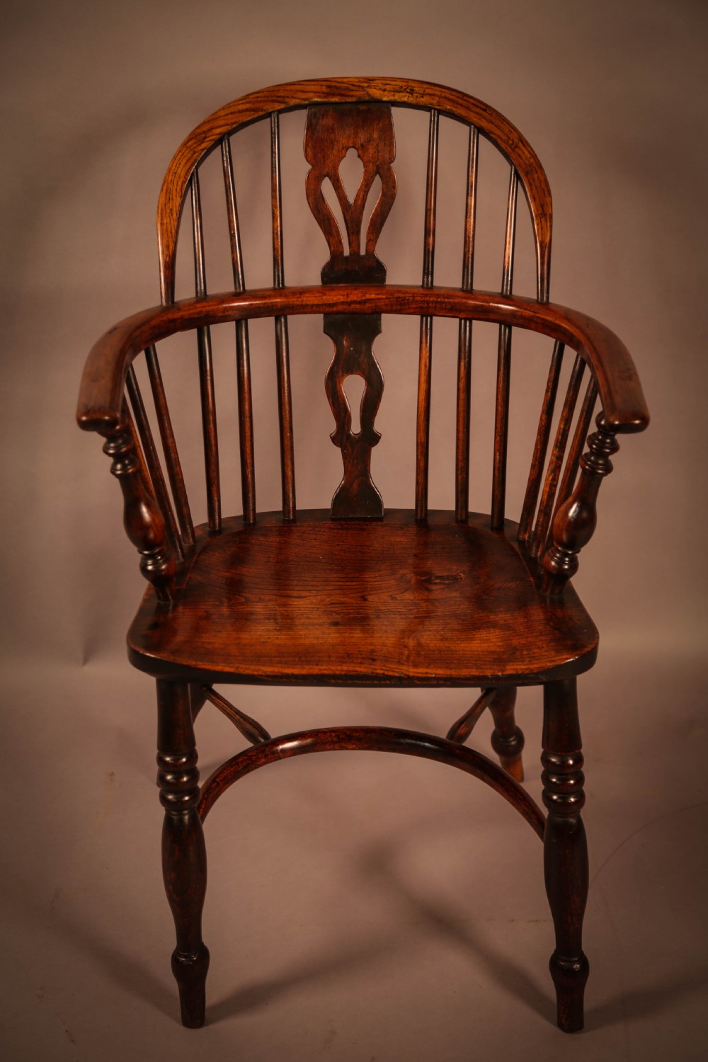An Ash and Elm Windsor Chair stamped F Walker Rockley